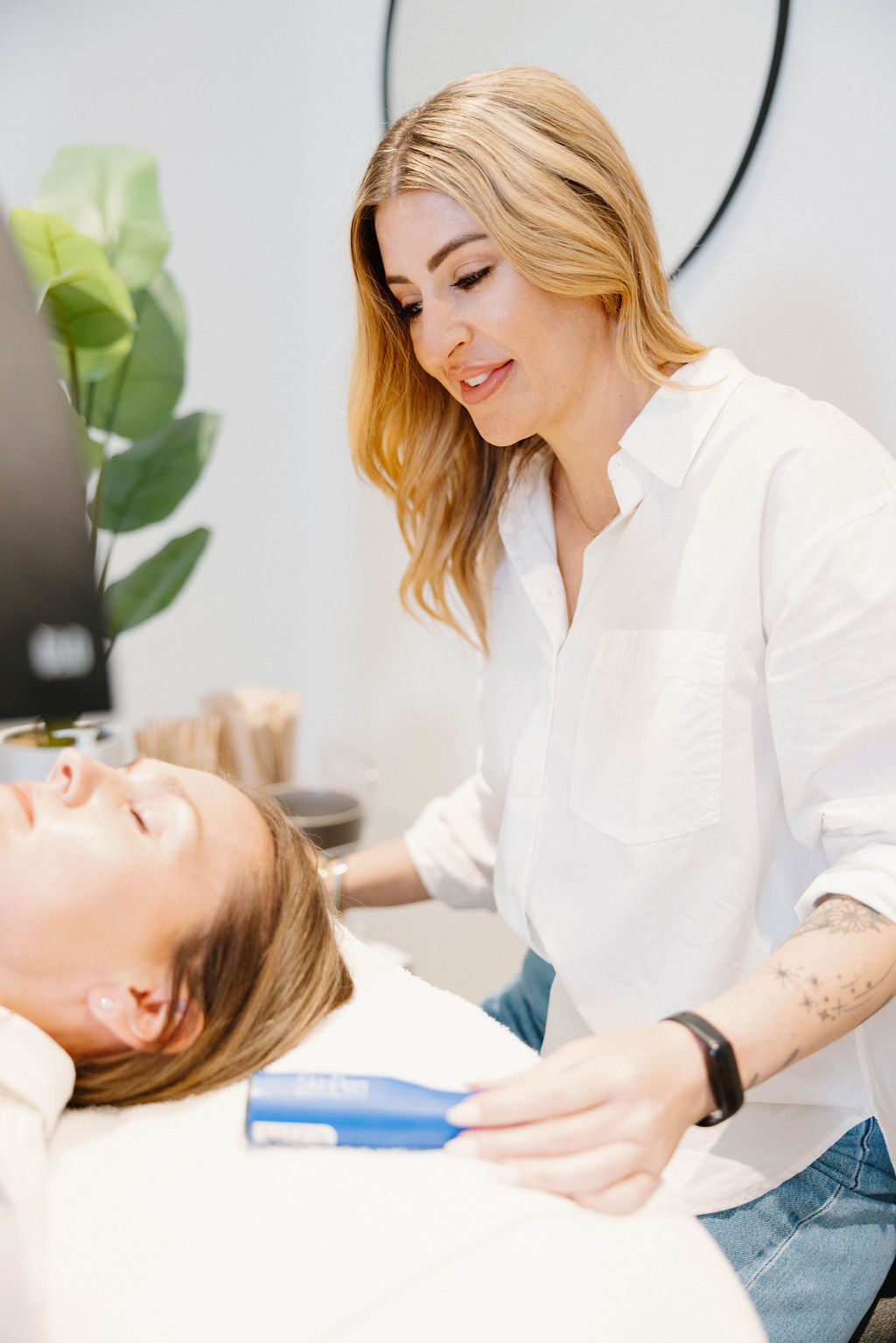 Aesthetician performing a facial treatment